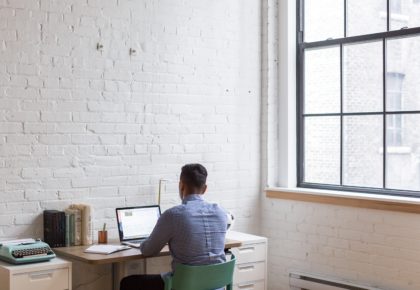 man working near window